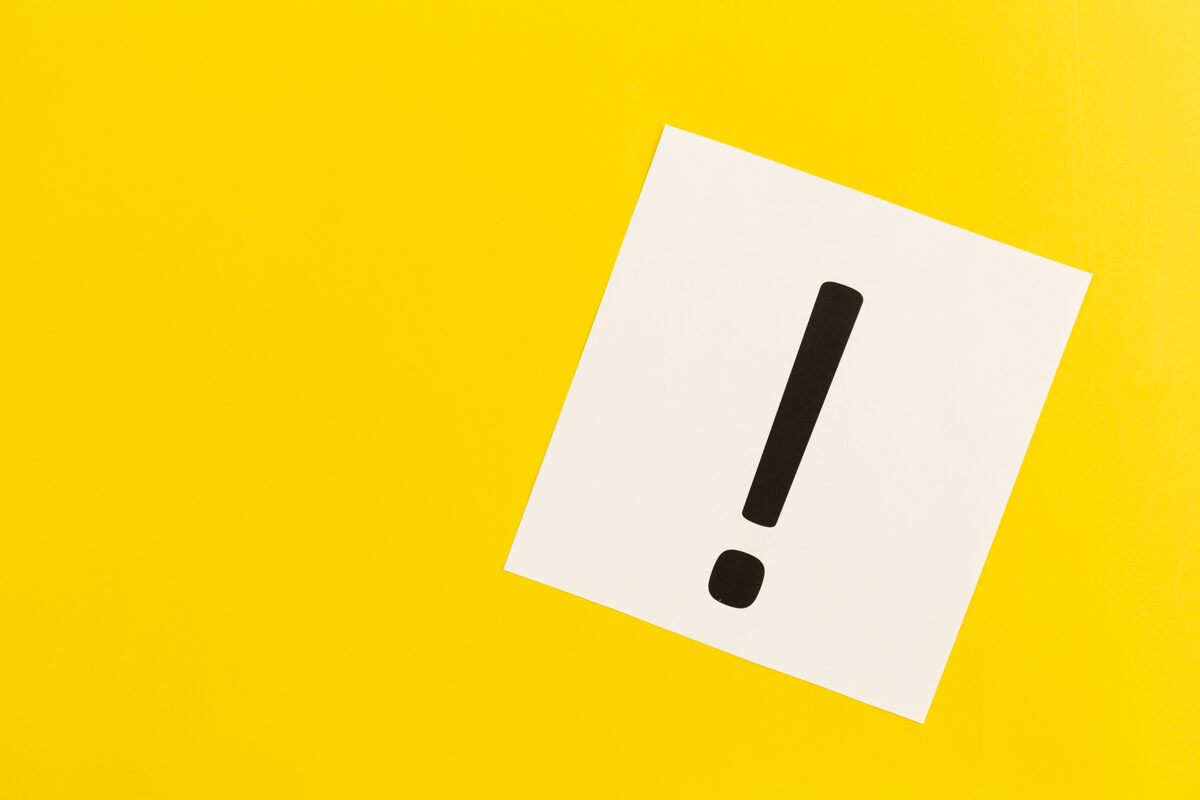 exclamation-mark-white-paper-yellow-background-flat-lay-4.jpg
